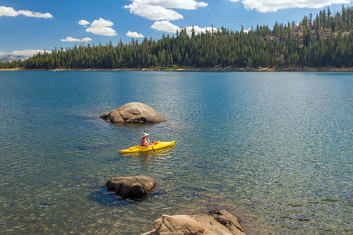 Kayaker on a mountain lake